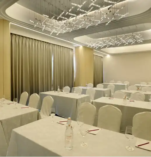 Senate Hall – Sophisticated Venue for Conferences, Seminars, and Celebrations Modern conference or banquet hall setup with elegant interiors and professional ambiance