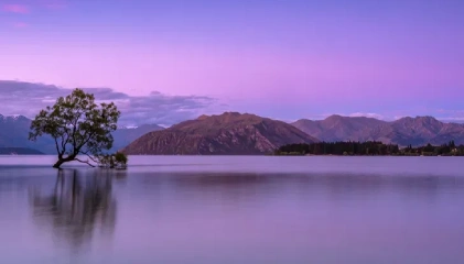 Turquoise waters of Pandoh Dam reflecting Himalayan peaks