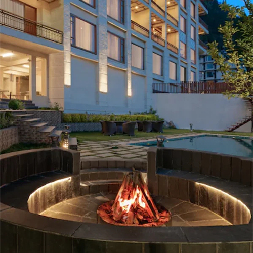 Hotel in Manali for Couples – Book Honeymoon Stay with Valley View Couple enjoying mountain view at honeymoon hotel in Manali India