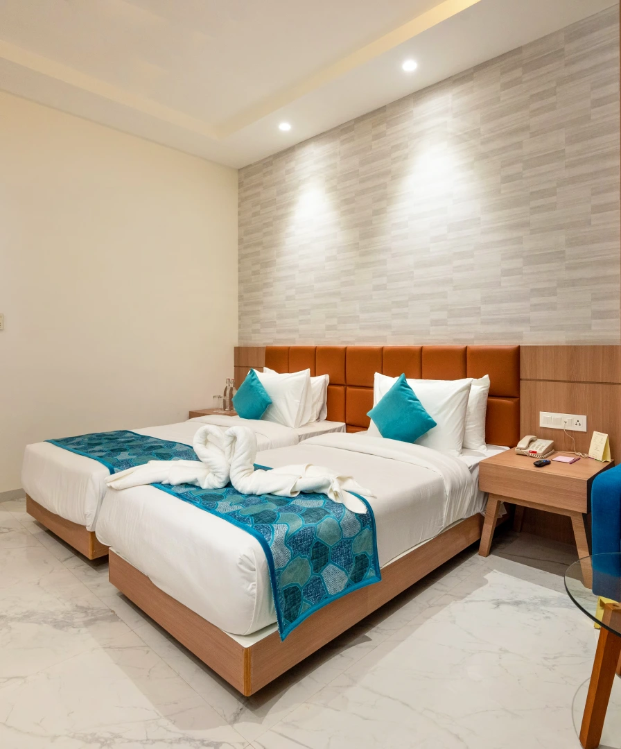 Jamnagar Hotel Rooms - Twin Bed Deluxe Stay for Business & Travel Twin Bed Deluxe Room at Orchid Hotel Jamnagar - Ideal for Business Stay