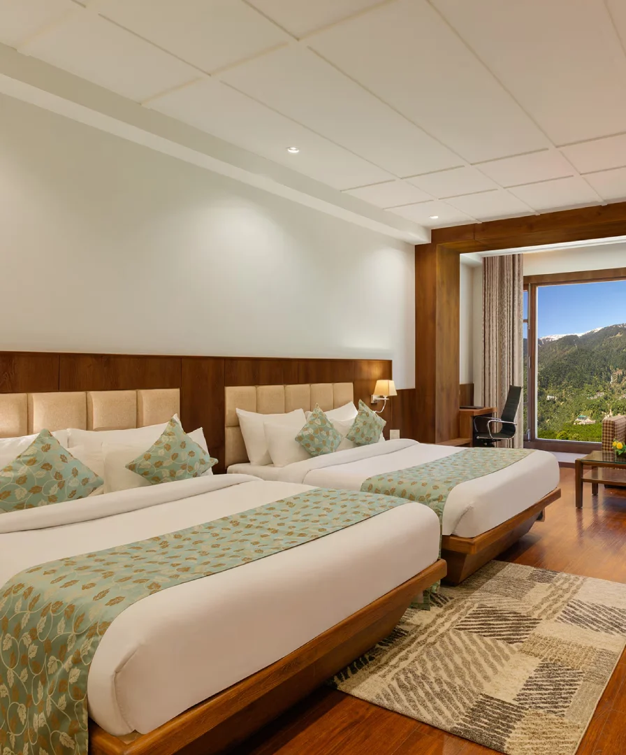 Spacious Family Stay – Premier Room at Orchid Hotel in Manali Premier Family Room in Manali with Balcony and Scenic Valley Views