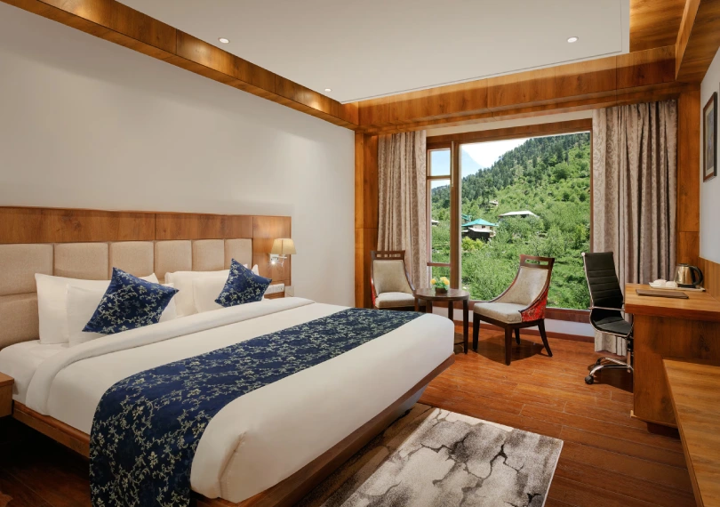 Book Deluxe Room in Manali Hotel – Luxury Stay at Orchid Hotels Deluxe Room at Orchid Hotel Manali featuring breathtaking mountain views and modern amenities