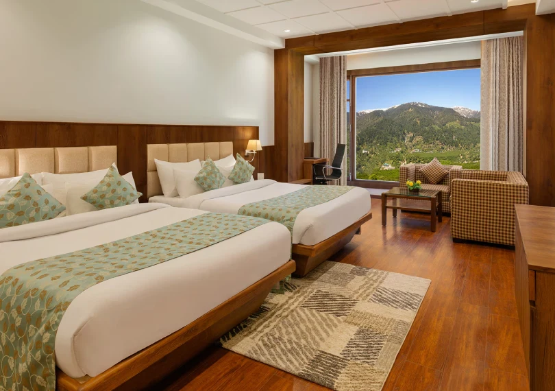 Best Manali Hotel – Family Room Booking in Manali Premier Family Room with spacious layout and panoramic valley views at Orchid Hotel Manali, perfect for families