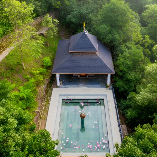 Book your stay at Orchid Rishivan Resort, top Rishikesh hotels with luxurious swimming pool Aerial view of swimming pool at the best hotels in Rishikesh - Orchid Rishivan Resort