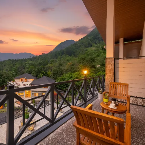 Reserve rooms with stunning balcony hill views at the best Rishikesh resorts - Orchid Rishivan Balcony with scenic hill view at Orchid Rishivan Rishikesh Resort, top resorts in Rishikesh