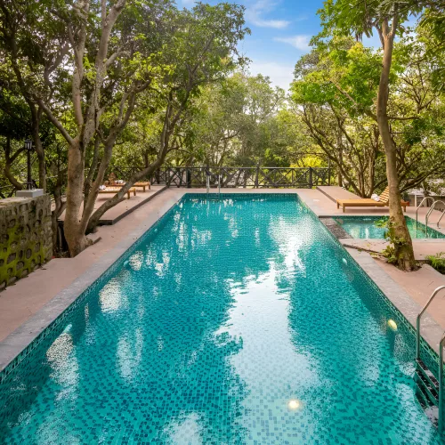 Book a stay at Orchid Rishivan Resort, best Rishikesh hotel with open swimming pool Open swimming pool at Orchid Rishivan Hotel Rishikesh, top resort near Byasi
