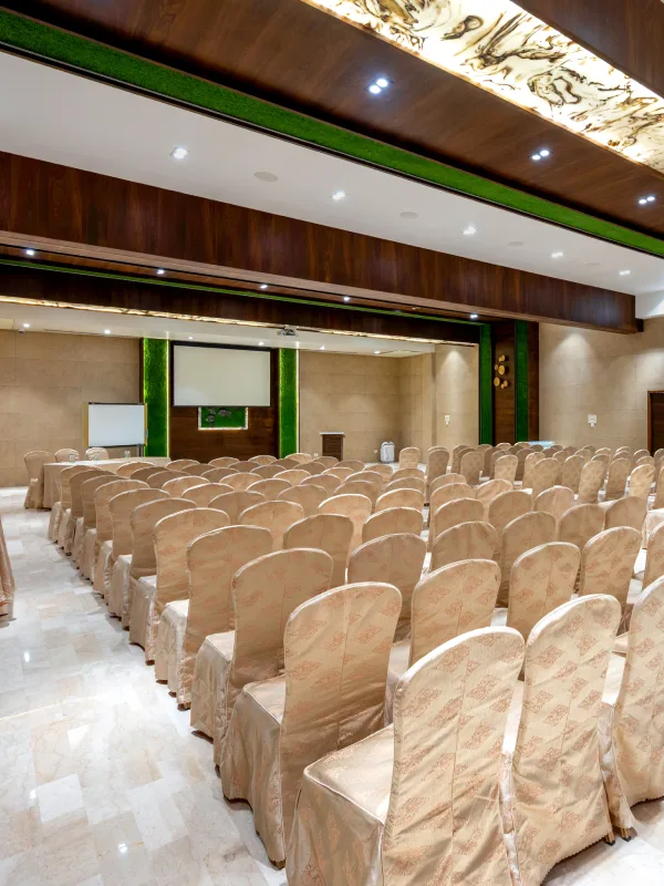 Banquet Hall Theatre Seating – Orchid Panchgani Event Venue Spacious banquet hall with theatre-style seating and marble ceiling at Orchid Hotel Panchgani