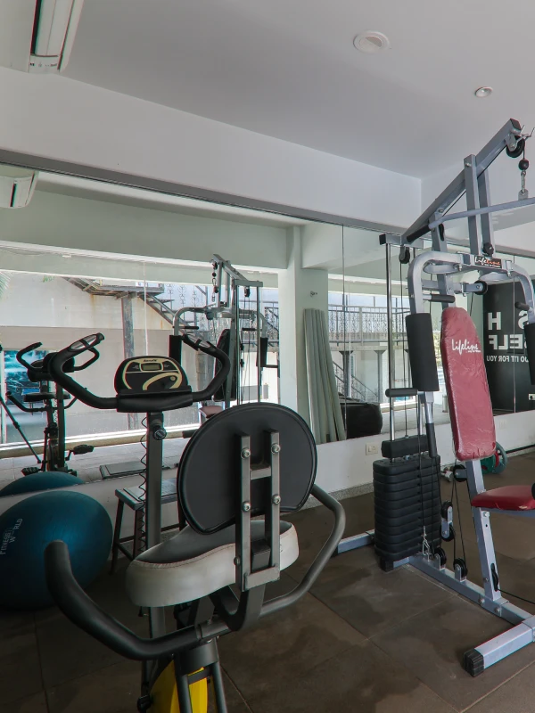Fitness Centre & Gym – Stay Fit at Orchid Hotel Panchgani Fitness centre with gym equipment, exercise bike, and multi-station at Orchid Hotel Panchgani