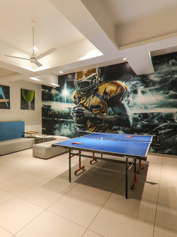 Games Room with Table Tennis – Family Fun at Orchid Panchgani Indoor games room with table tennis and lounge seating at Orchid Hotel Panchgani for family entertainment