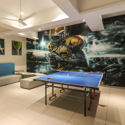 Games Room – Family Activities at Orchid Panchgani Table tennis games room with lounge seating at Orchid Hotel Panchgani