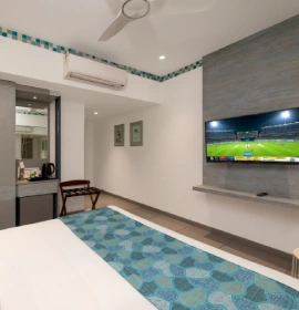 Dew Drop Queen Bed Room with TV - Orchid Hotel Panchgani Dew Drop queen bed room with flat screen TV and AC at Orchid Hotel Panchgani