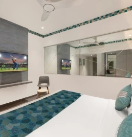 Dew Drop Room Queen Bed Glass Wall - Orchid Hotel Panchgani Spacious Dew Drop queen bed room with glass wall and TV at hotel in Panchgani